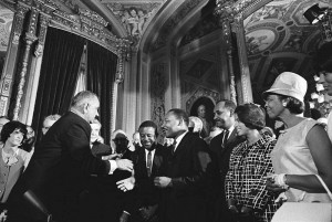Pres. Lyndon B. Johnson , Rev. Martin Luther King, Jr., and Rosa Parks at the Voting Rights Act signing