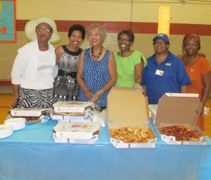  Friends of Emancipation Park Boards Members, Dorris Ellis, Jacqueline Bostic, Jackie Bostic, Jackie Gilmore,  JoAnn Johnson( Park Director) and Alma Thompson setting-up pizza station. 