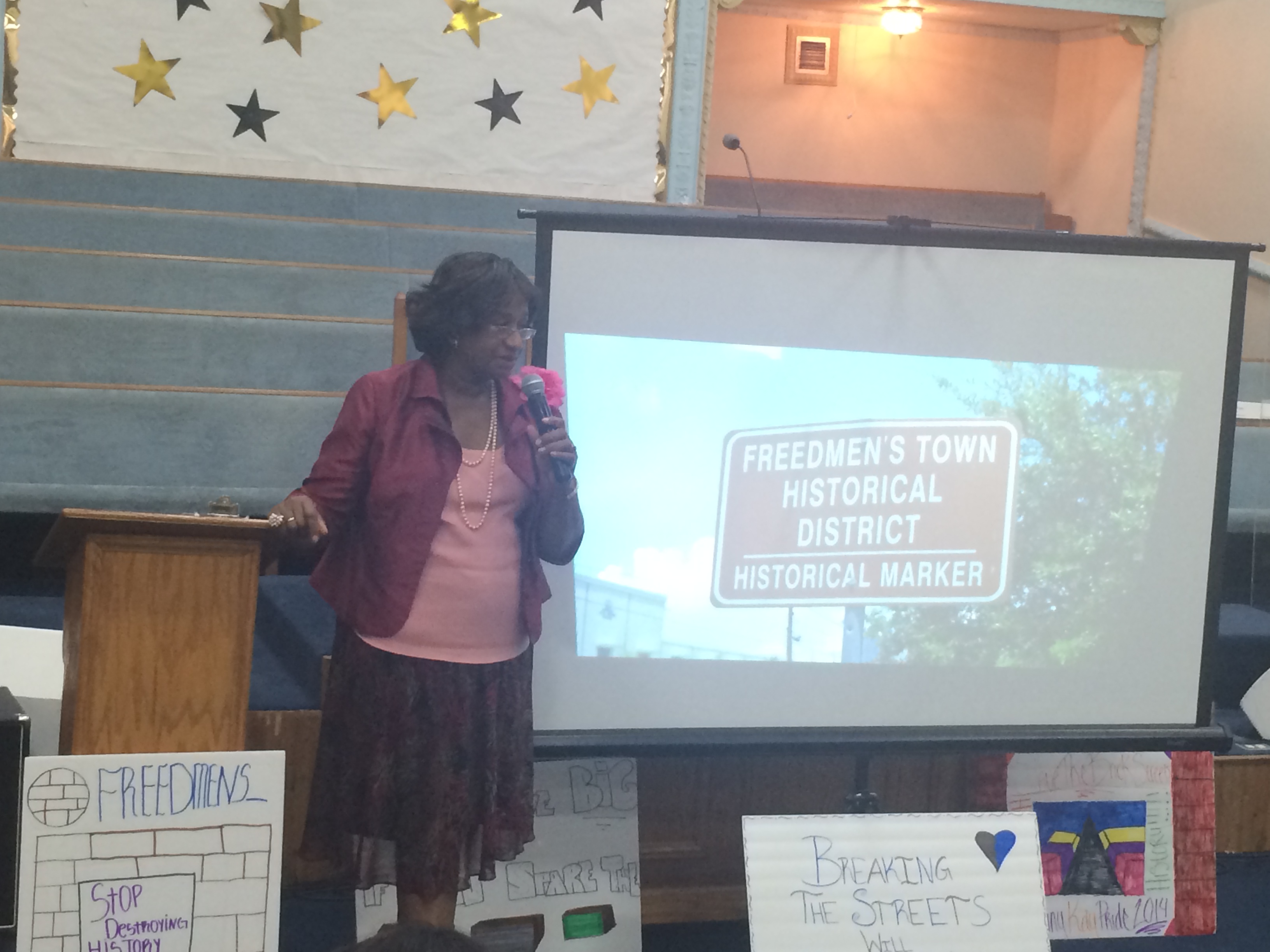 Dorris Ellis Robinson educating the community on the status of the streets during a town hall at Mt. Horeb Baptist Church in Freedmen's Town.