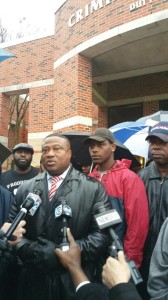 Quanell X speaking to the media , requesting the video surveillance.