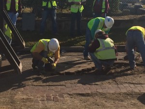 Conrad Construction workers taking up the historical bricks in Freedmen's Town.
