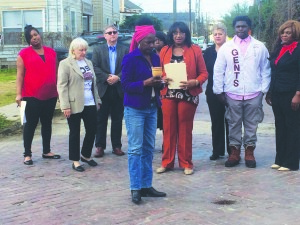 Gladys House of the FTPC, leading a libation ritual before the press conference.